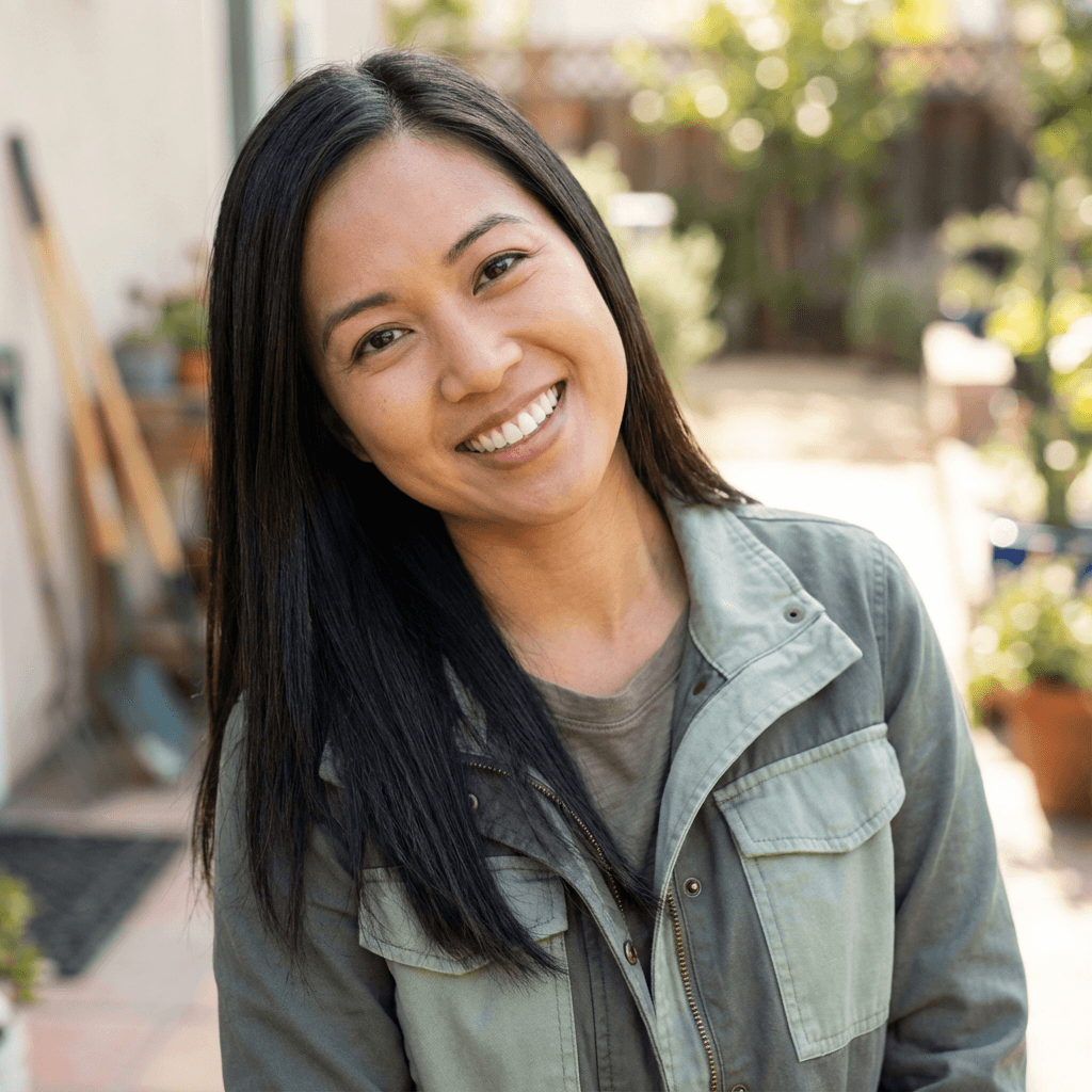 Professional headshot of a woman in business attire near a retail warehouse